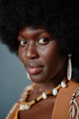 Portrait of a smiling African woman customer